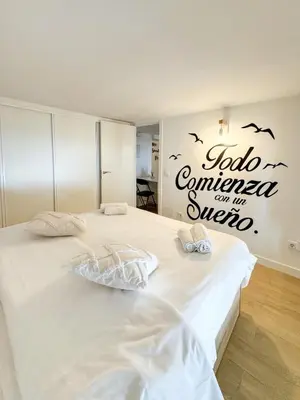 Cama o camas de una habitación en Plaza Mayor Suites 1