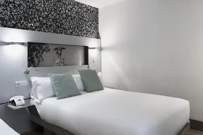 Cama o camas de una habitación en Petit Palace Plaza Mayor