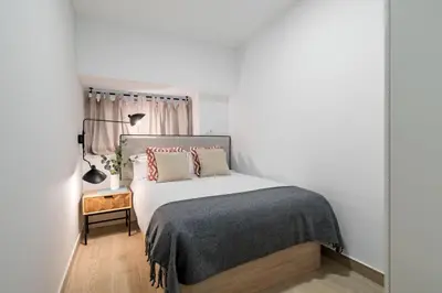 Cama o camas de una habitación en Apartamentos modernos en Atocha