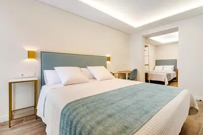 Cama o camas de una habitación en CH Las Artes de Atocha