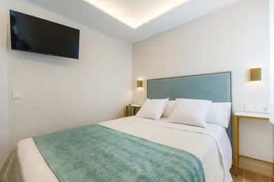 Cama o camas de una habitación en CH Las Artes de Atocha