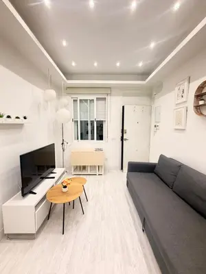 Una televisión o centro de entretenimiento en Precioso Apartamento Moderno Recién Reformado