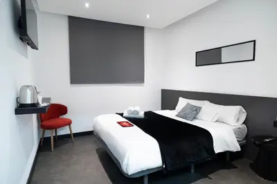 Cama o camas de una habitación en Mad Rooms