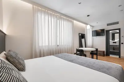 Cama o camas de una habitación en Pacifico Suites near Retiro