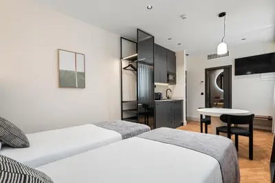 Cama o camas de una habitación en Pacifico Suites near Retiro