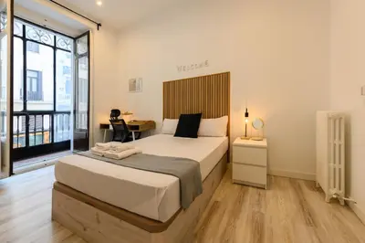 Cama o camas de una habitación en Washington habitación con comodidad y zonas compartidas Gran Vía-Madrid Temporal SBE1014
