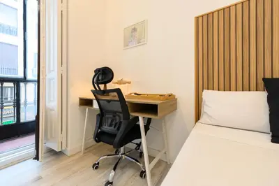 Cama o camas de una habitación en Washington habitación con comodidad y zonas compartidas Gran Vía-Madrid Temporal SBE1014