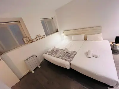 Cama o camas de una habitación en Cruz1625Madrid