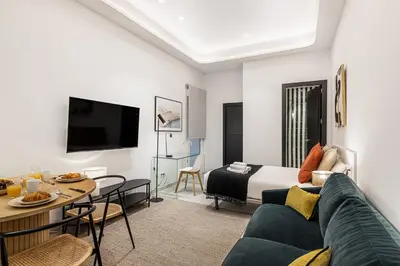 Una televisión o centro de entretenimiento en Waou Urban Home Salamanca I