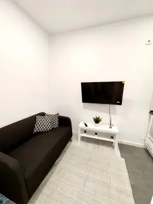 Una televisión o centro de entretenimiento en Apartament comfort