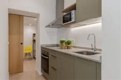 Una cocina o zona de cocina en Retiro City Center Apartment