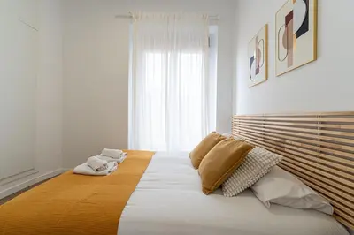 Cama o camas de una habitación en Green Lavapiés by Hogar4