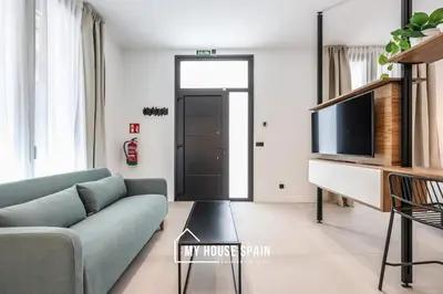 Una televisión o centro de entretenimiento en MyHouseSpain - Santero Apartments A