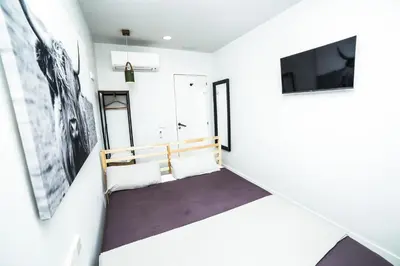 Una televisión o centro de entretenimiento en Hotel Maruja en Cascorro