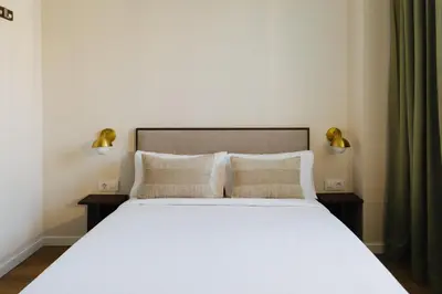 Cama o camas de una habitación en Atipico Madrid