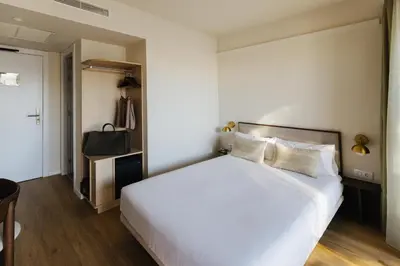 Cama o camas de una habitación en Atipico Madrid