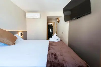 Cama o camas de una habitación en Negresco Plaza Mayor