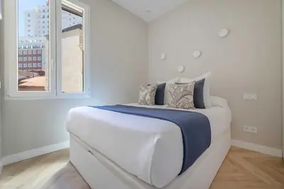 Cama o camas de una habitación en Moderno apartamento junto a Plaza España