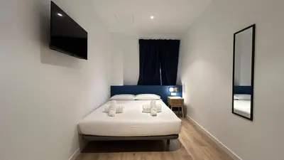 Cama o camas de una habitación en Hotelito Boutique Madrid Pacífico