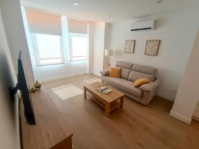 Una televisión o centro de entretenimiento en Apartamentos DALA