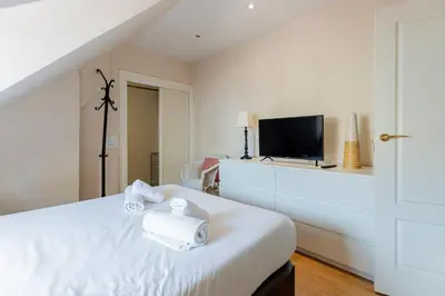 Una televisión o centro de entretenimiento en GuestReady - Cosy place in Madrid