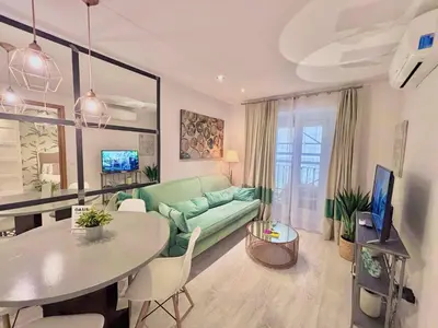 Una televisión o centro de entretenimiento en Santo Domingo II - 1 Bedroom Apartment in Gran Via