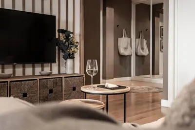 Una televisión o centro de entretenimiento en Puebla - 1 bedroom and shared pool in Recoletos