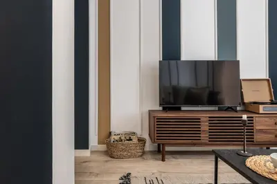 Una televisión o centro de entretenimiento en Favola - 1 bedroom in Arapiles