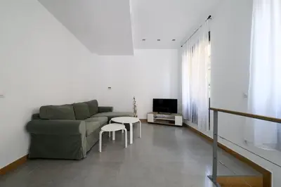 Una televisión o centro de entretenimiento en GuestReady - Your Urban Retreat in Madrid