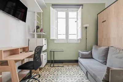 Zona de estar de Private room in Malasaña #4