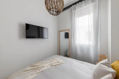 Una televisión o centro de entretenimiento en Chamberi City Center Apartment