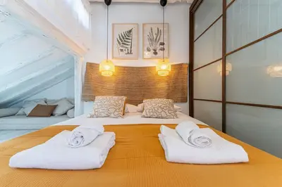 Cama o camas de una habitación en Roof Malasaña by Hogar 4