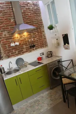 Una cocina o zona de cocina en Encantador Apartamento en el Corazón de Madrid