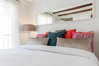 Cama o camas de una habitación en Cozy Apartment Chueca Gran Via