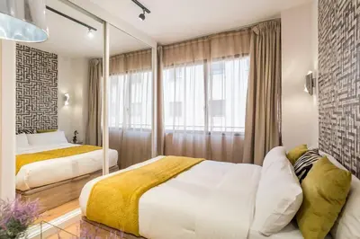 Cama o camas de una habitación en NEW APT PUERTA DE ALCALA RETIRO PARK