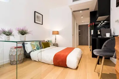Cama o camas de una habitación en NEW APT PUERTA DE ALCALA RETIRO PARK