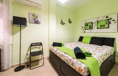 Cama o camas de una habitación en Apartamentos Madrid XXXIII - Alojamiento de Temporada