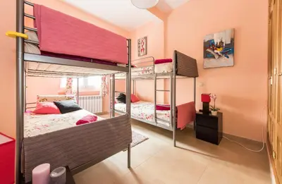 Cama o camas de una habitación en Apartamentos Madrid XXXIII - Alojamiento de Temporada