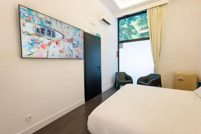 Cama o camas de una habitación en WE MADRID STUDIOS centro