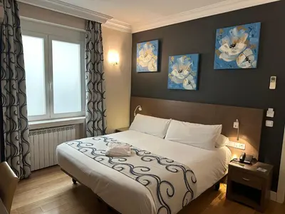 Cama o camas de una habitación en Hostal Sol Square Madrid