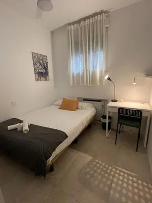 Cama o camas de una habitación en Cáceres habitaciones