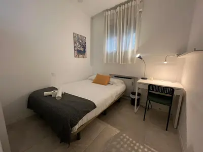 Cama o camas de una habitación en Cáceres habitaciones