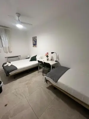 Cama o camas de una habitación en Cáceres habitaciones