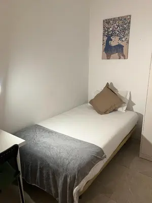 Cama o camas de una habitación en Cáceres habitaciones