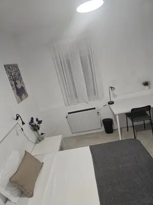 Cama o camas de una habitación en Cáceres habitaciones