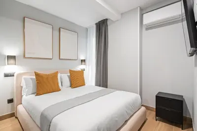 Cama o camas de una habitación en Dobo Madrid Portugal