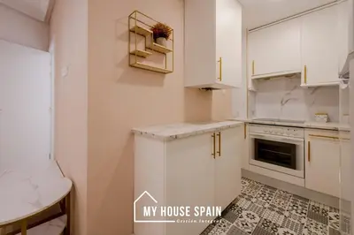 Una cocina o zona de cocina en MyHouseSpain - Encantador apartamento en Madrid