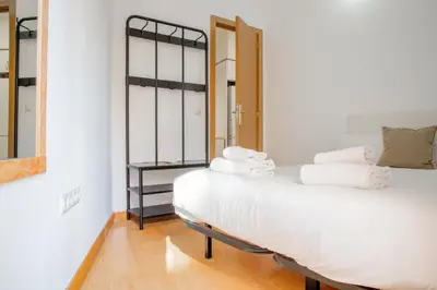 Cama o camas de una habitación en Gran Vía Green Apartments