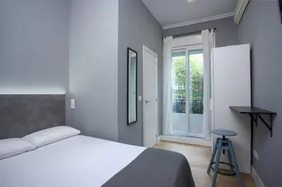 Cama o camas de una habitación en Atocha Rooms