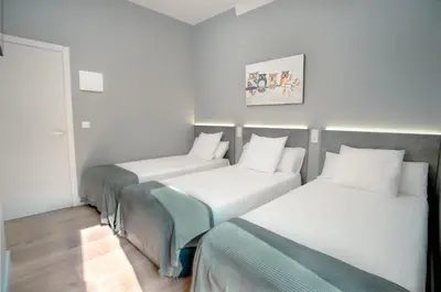 Cama o camas de una habitación en Atocha Rooms